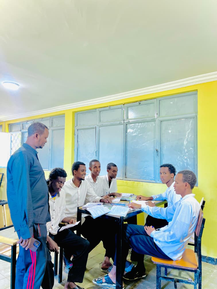Teacher with senior students
